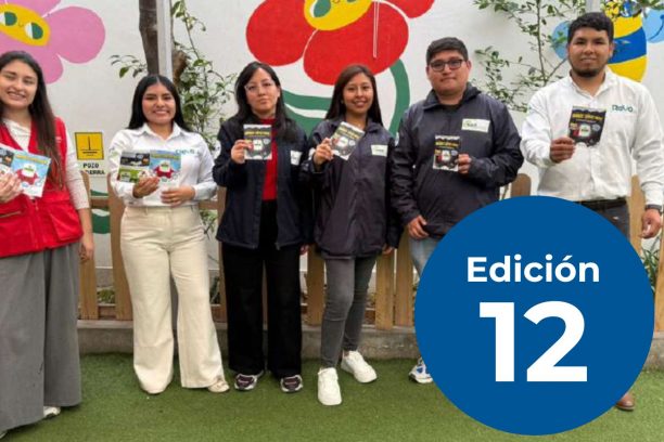 Six young adults standing side by side outdoors in front of a colorful flower mural, each holding a small pamphlet, with a large blue circular graphic reading “Edición 12” partially covering the right side.